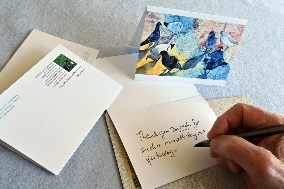 A short note is being written on a card